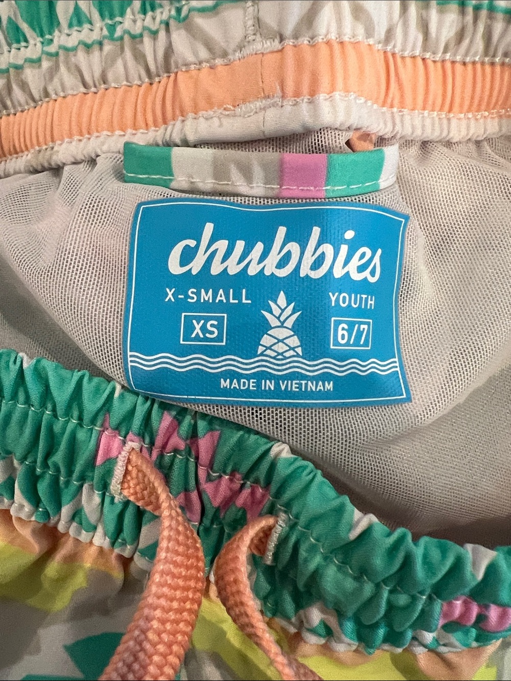 chubbies Teal Aztec Print Kids Swim Trunks with Pink and Peach Accents - Picture 3 of 4